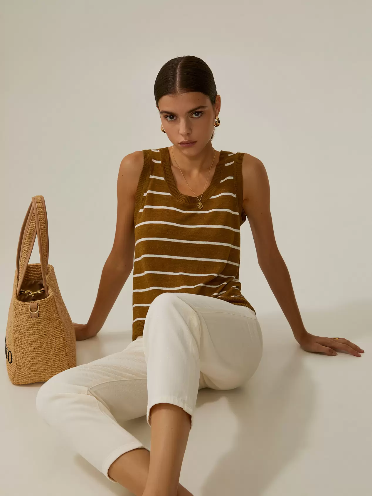 Oferta de Striped knit top with linen por 39,98€ em Decenio