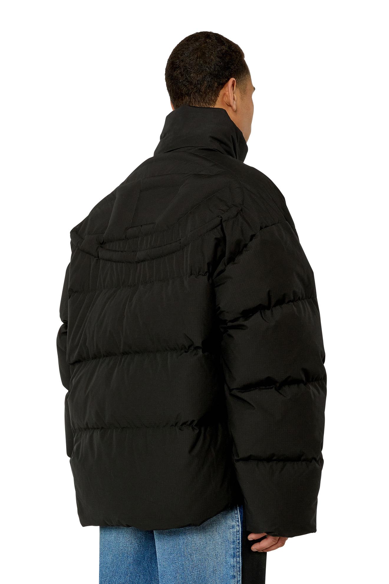 Oferta de Oversized down jacket with mega logo por 495€ em Diesel