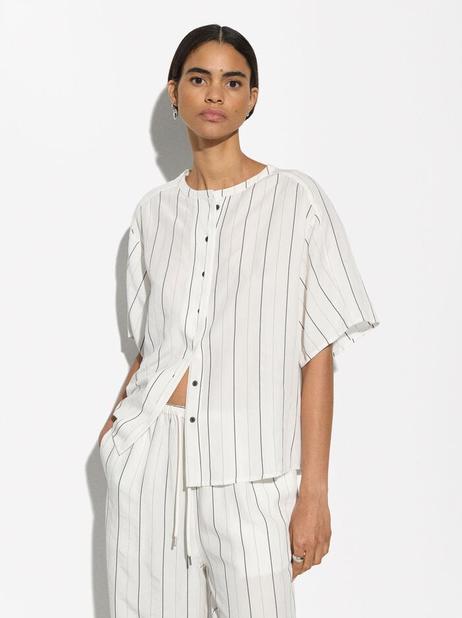 Oferta de Short-Sleeved Shirt With Linen por 19,99€ em Parfois