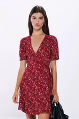 Oferta de Vestido curto cruzado estampado por 15,99€ em Springfield